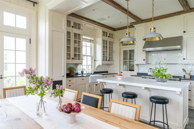 a kitchen with a sink and lots of wooden cabinets