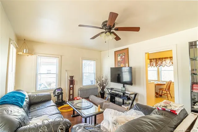 a living room with furniture and a flat screen tv