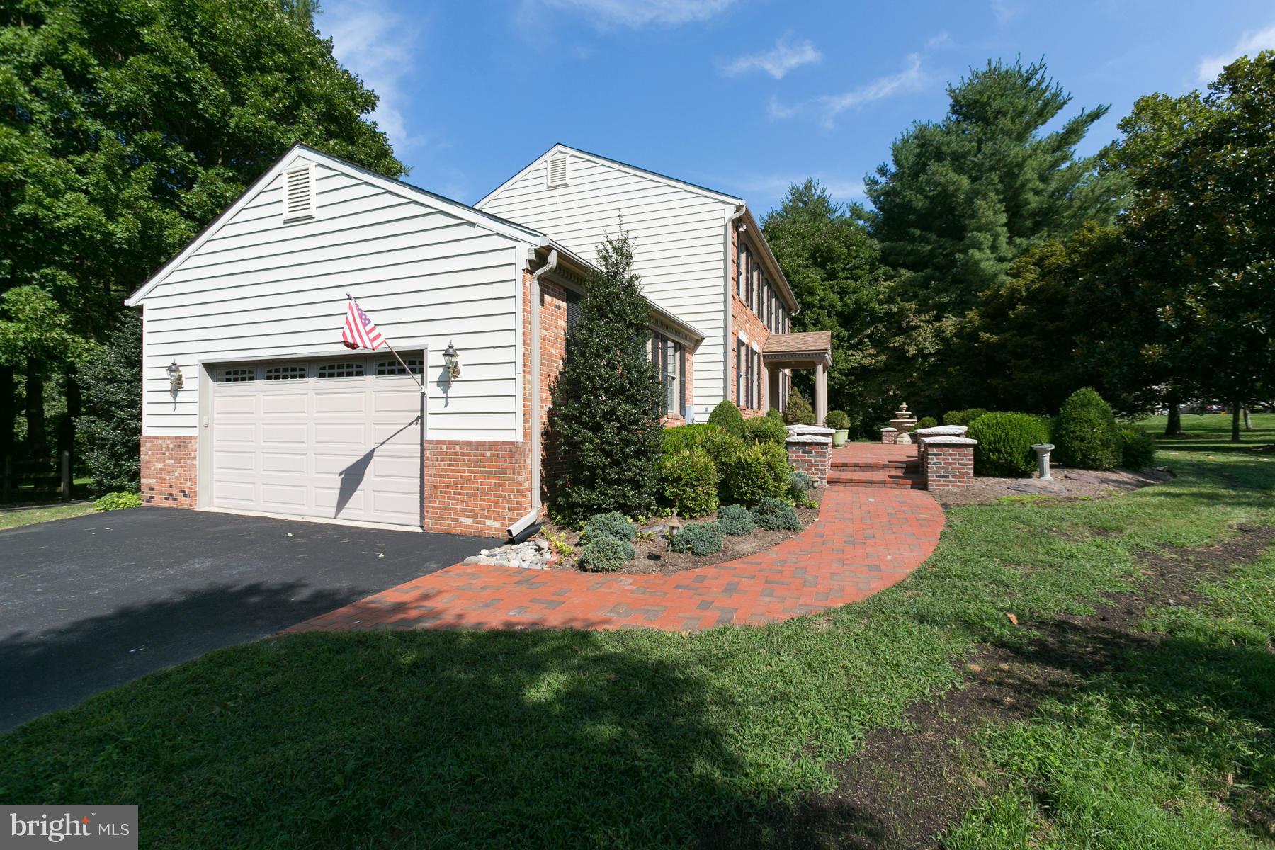 8340 Waverly Road Owings, MD 20736 - Photo 11 of 30 a front view of a house with a yard and trees