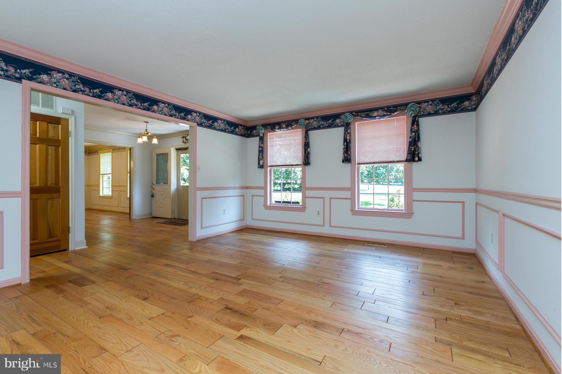 8340 Waverly Road Owings, MD 20736 - Photo 14 of 30 wooden floor in an empty room with a window