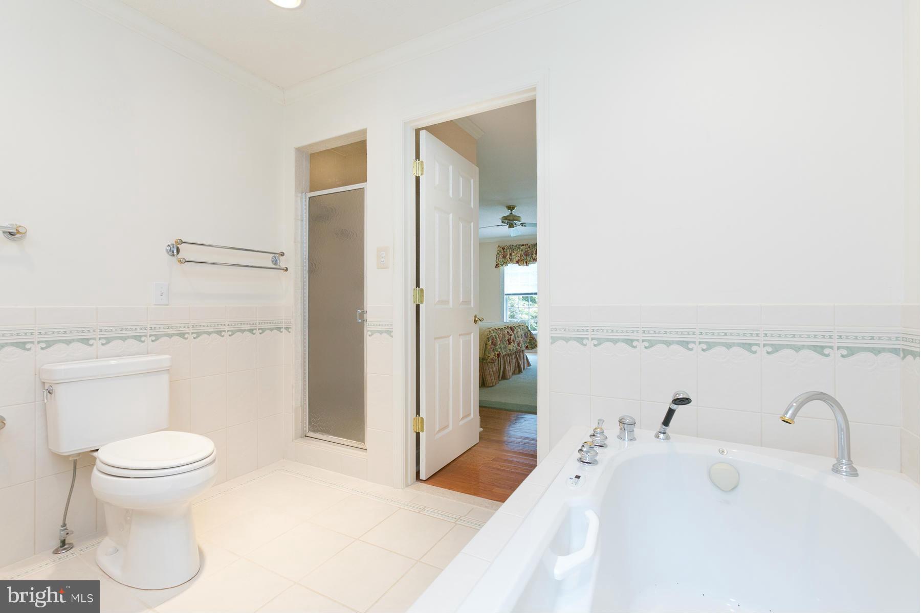 8340 Waverly Road Owings, MD 20736 - Photo 27 of 30 a bathroom with a sink a toilet and shower