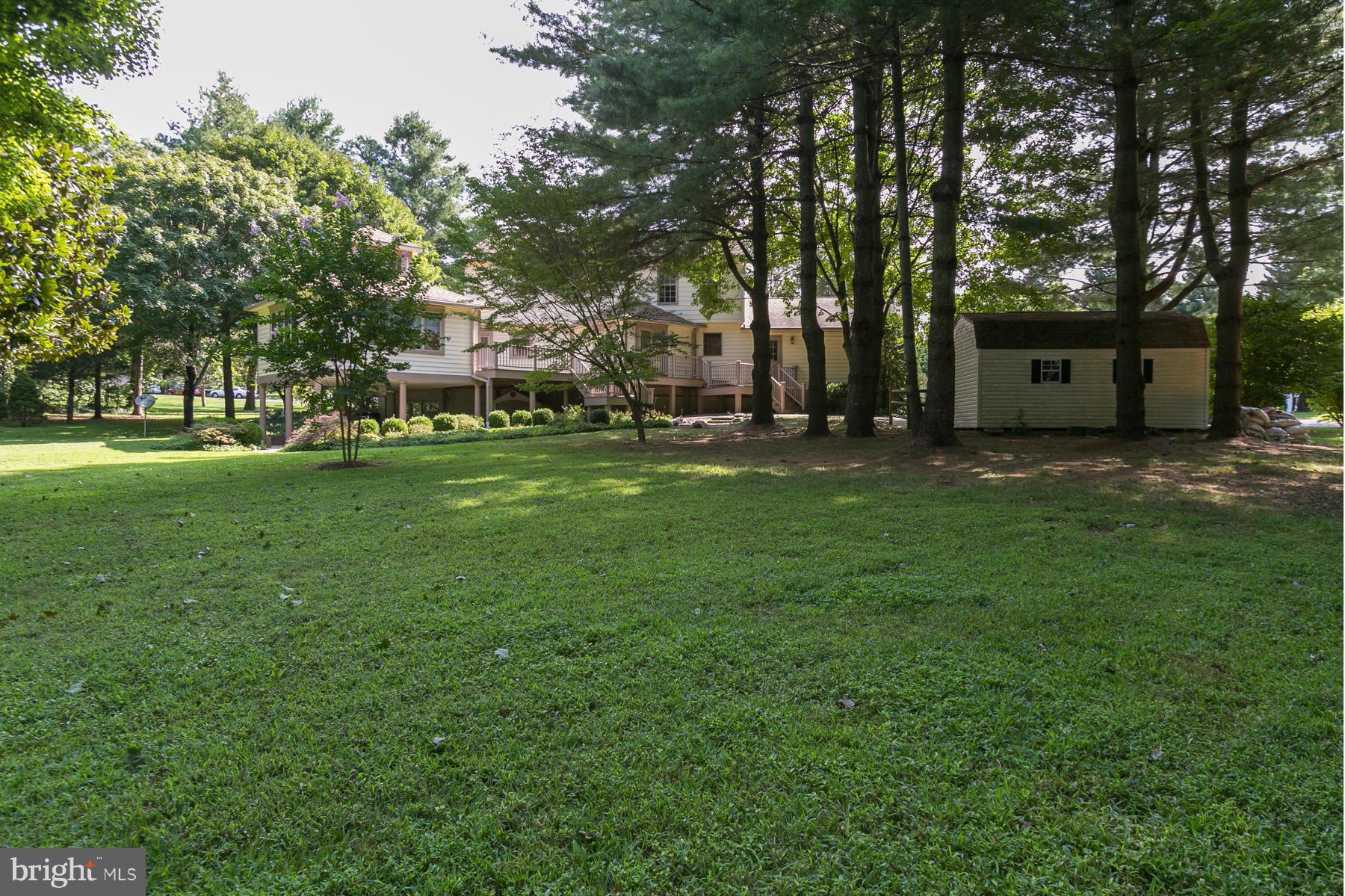 8340 Waverly Road Owings, MD 20736 - Photo 5 of 30 a backyard of a house with table and chairs