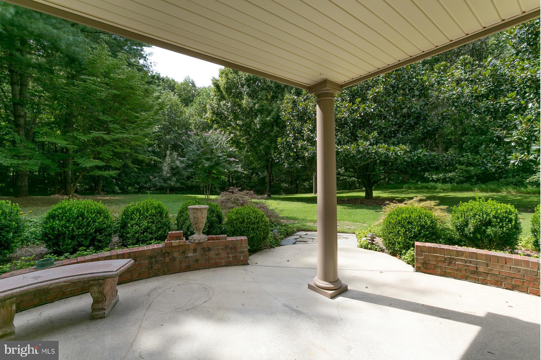 8340 Waverly Road Owings, MD 20736 - Photo 8 of 30 a view of a patio with a table chairs and a backyard