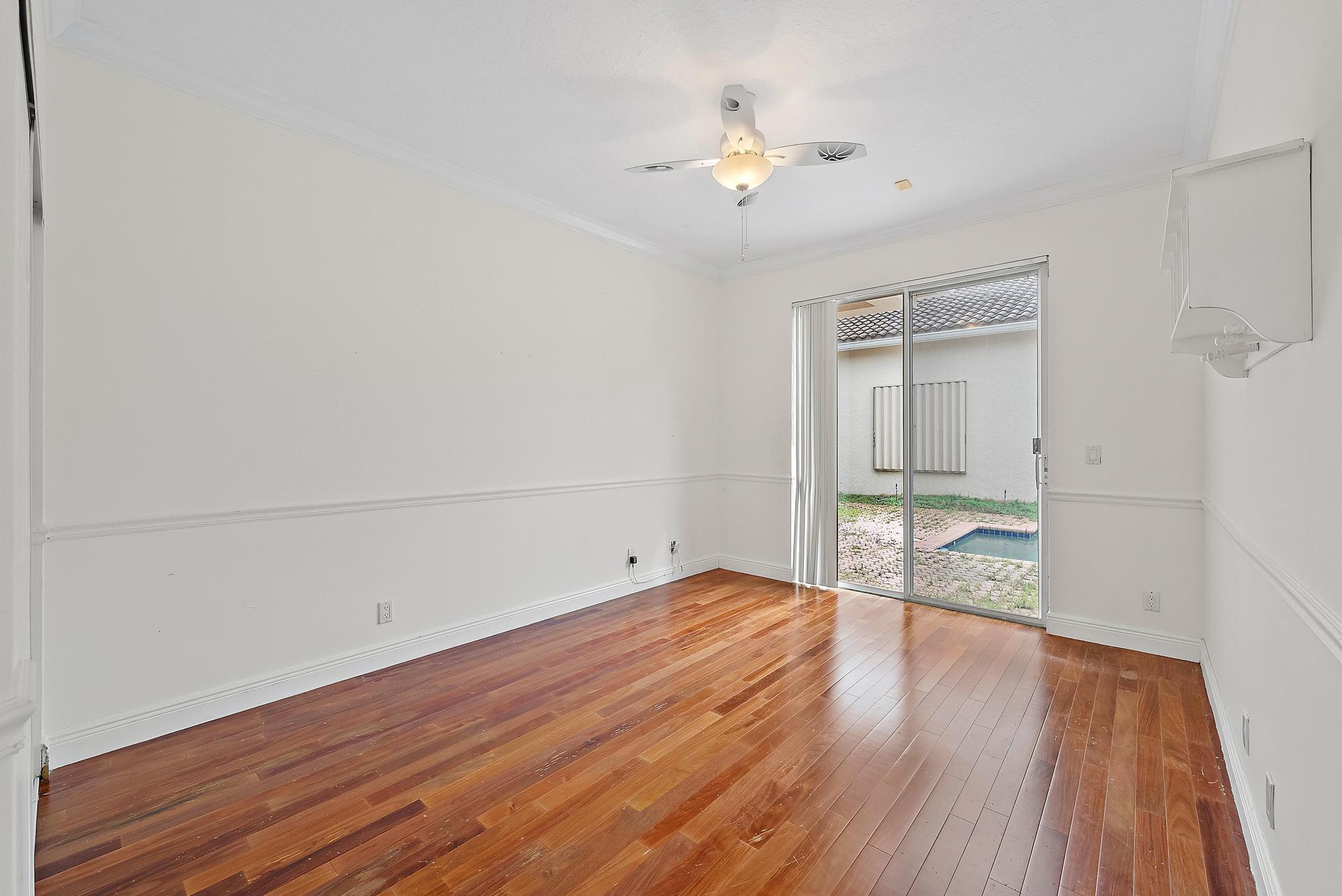 6612 Northwest 23rd Terrace Boca Raton, FL 33496 - Photo 17 of 20 a view of an empty room with wooden floor