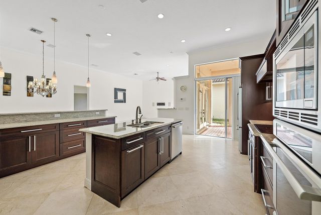 a kitchen with stainless steel appliances granite countertop a stove and a sink