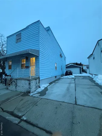 a front view of a house with garage
