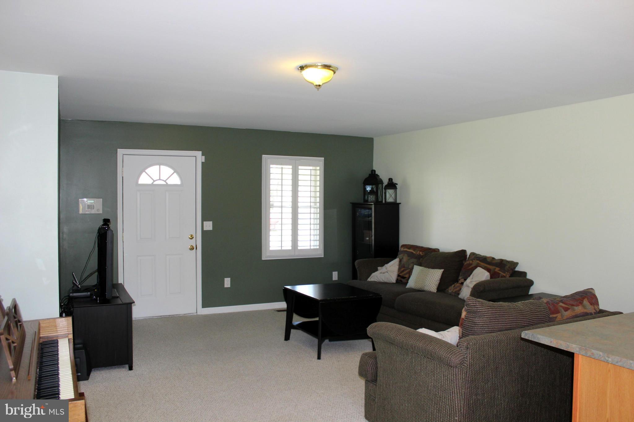 110 East Fourteenth Avenue Ranson, WV 25438 - Photo 5 of 18 Living Room with Wall to Wall Carpet