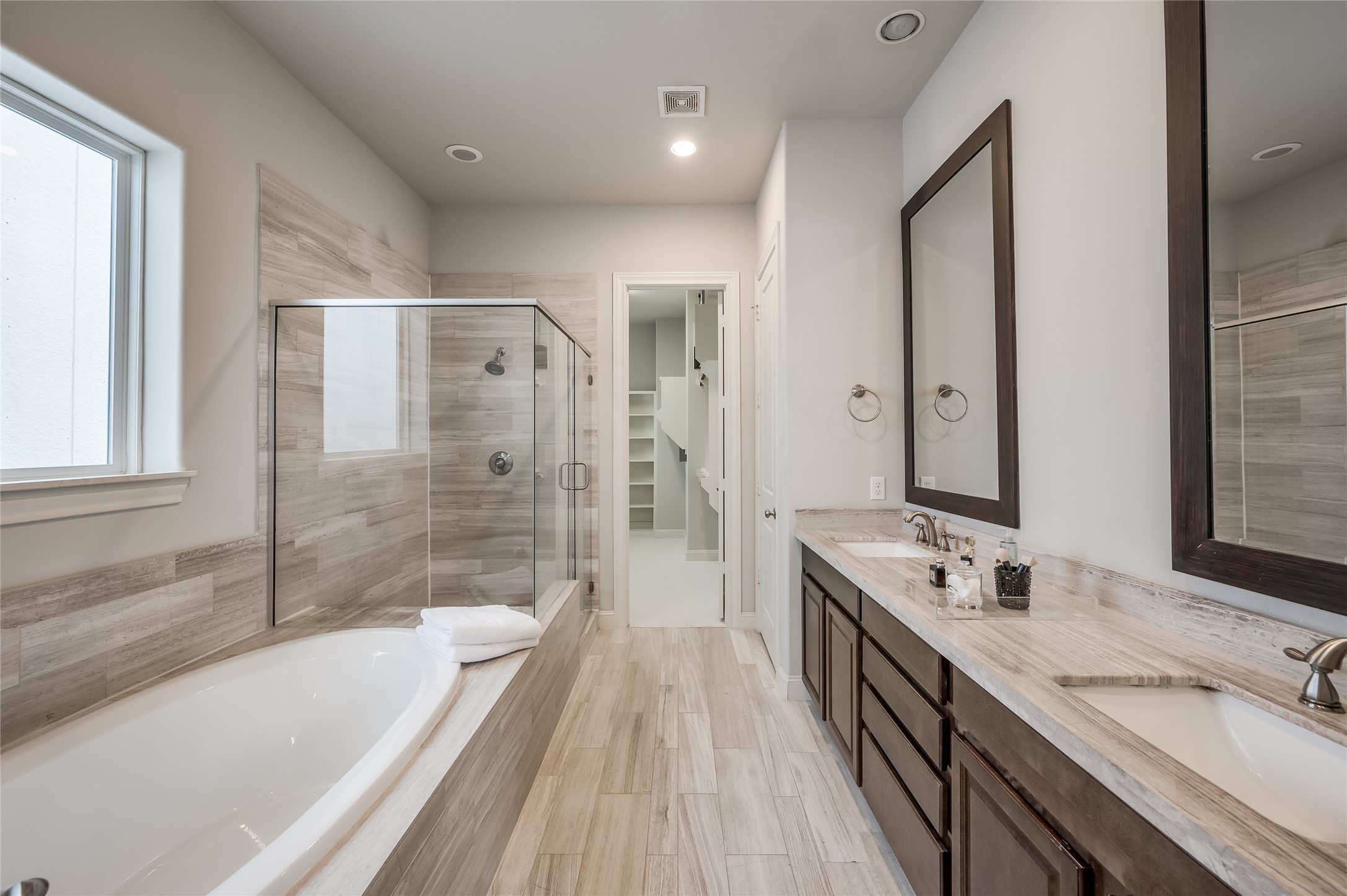 266 East 28th Street Houston, TX 77008 - Photo 1 of 33 a spacious bathroom with a granite countertop tub sink a mirror a shower and vanity