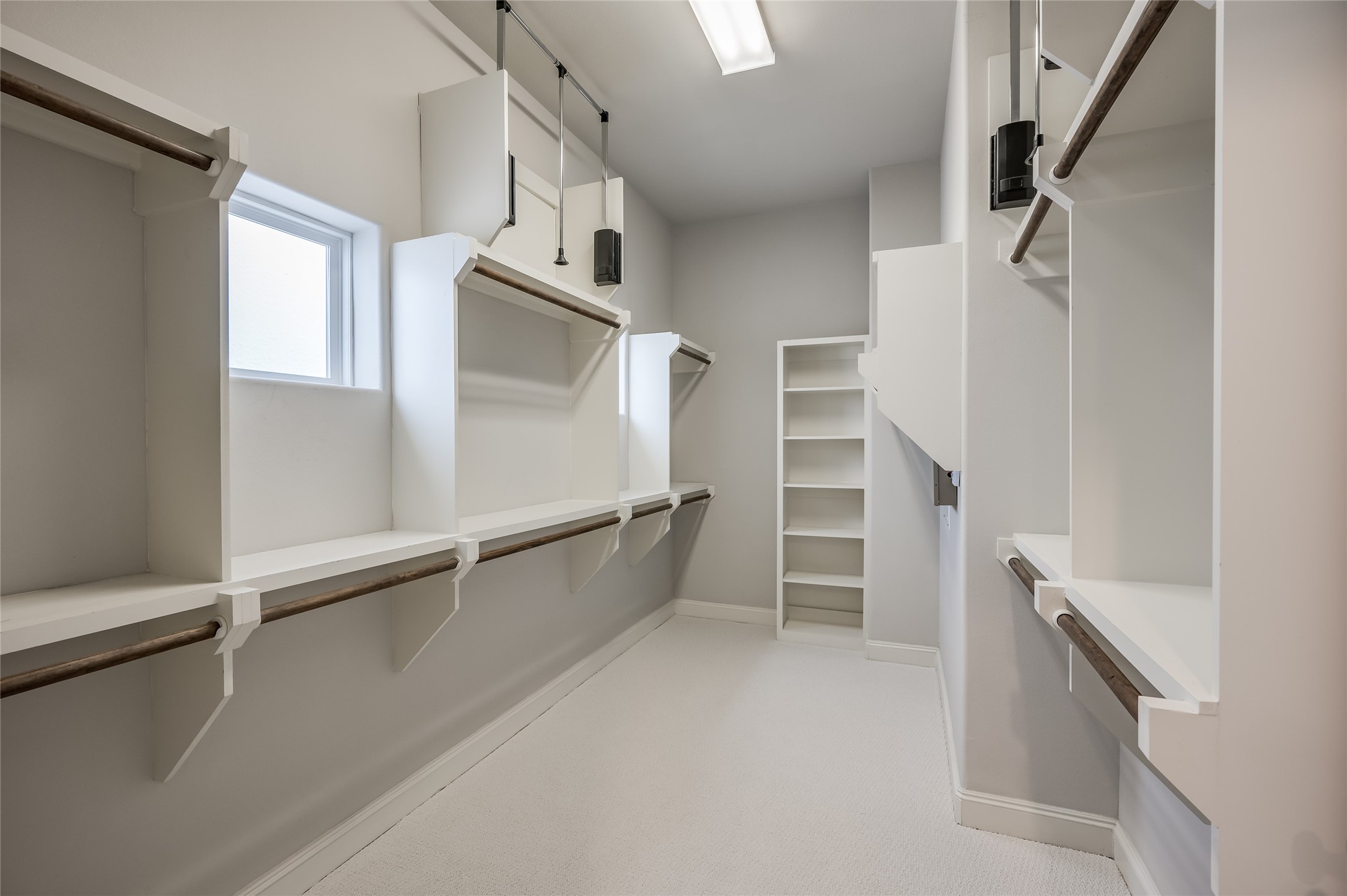 266 East 28th Street Houston, TX 77008 - Photo 12 of 33 a view of walk in closet with empty racks