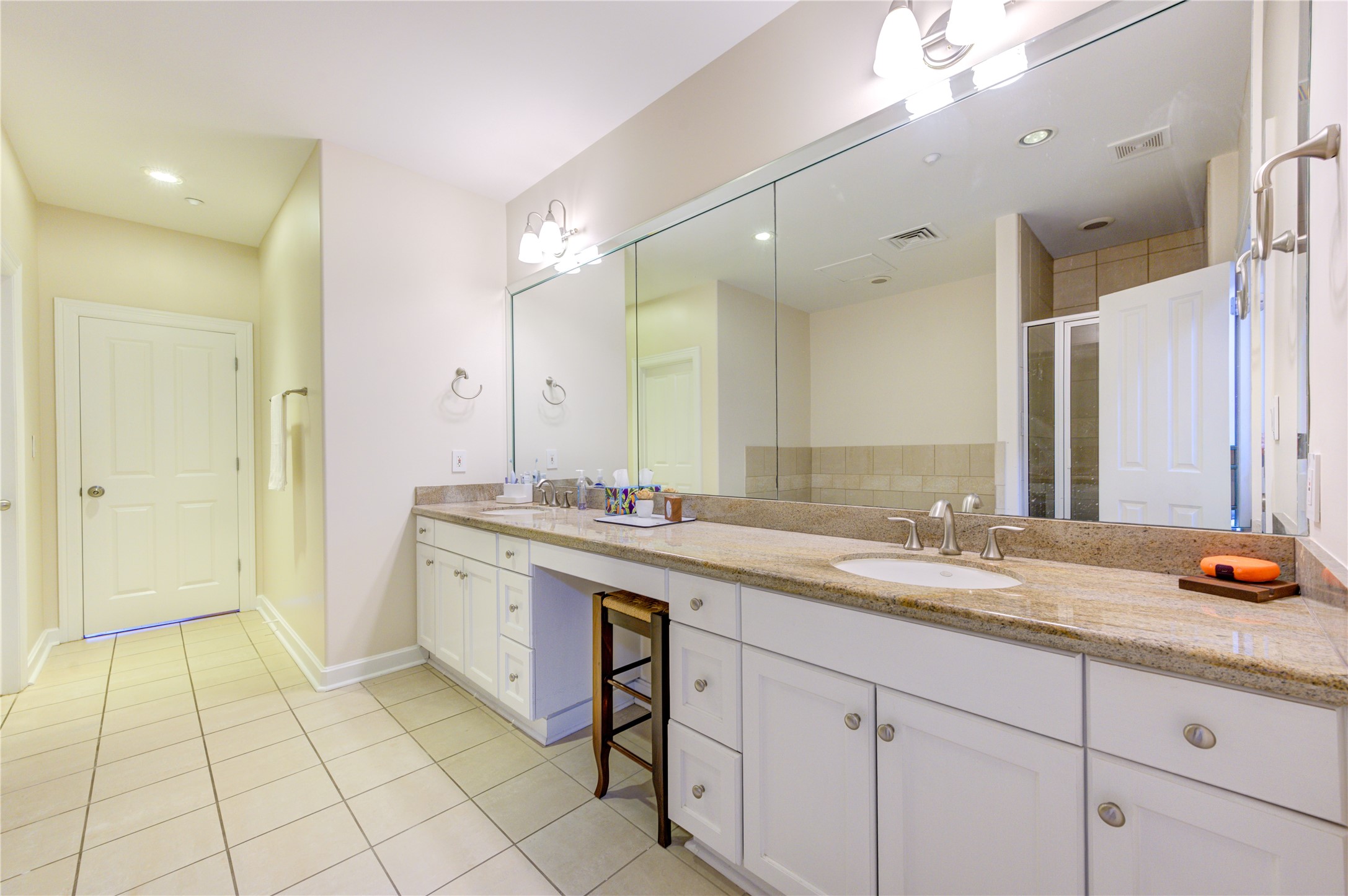 914 Main Street, Unit 911 Houston, TX 77002 - Photo 26 of 30 a spacious bathroom with a granite countertop sink a mirror and a