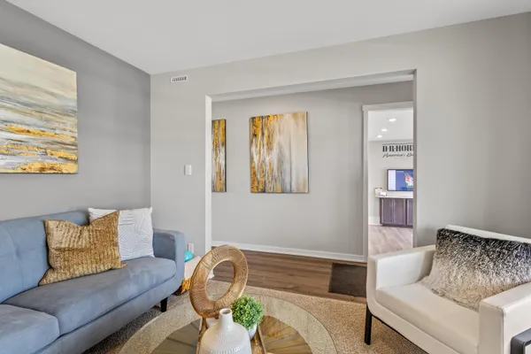 a living room with furniture and a window