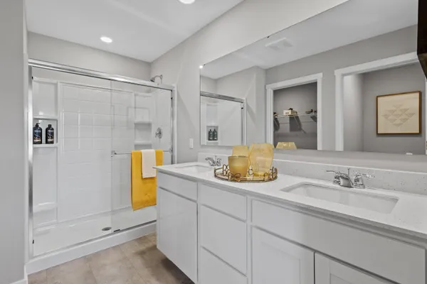 a bathroom with a granite countertop sink mirror and shower