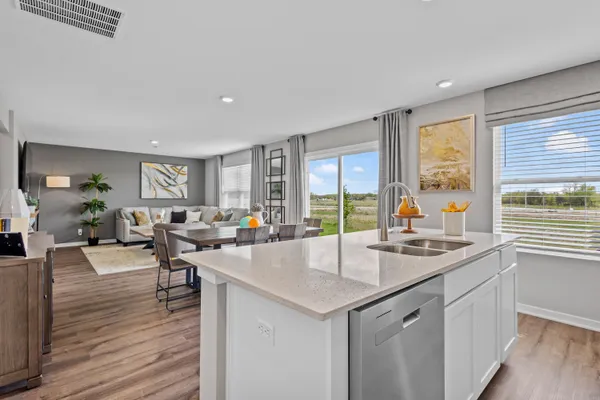 a very nice looking living room with wooden floor and furniture