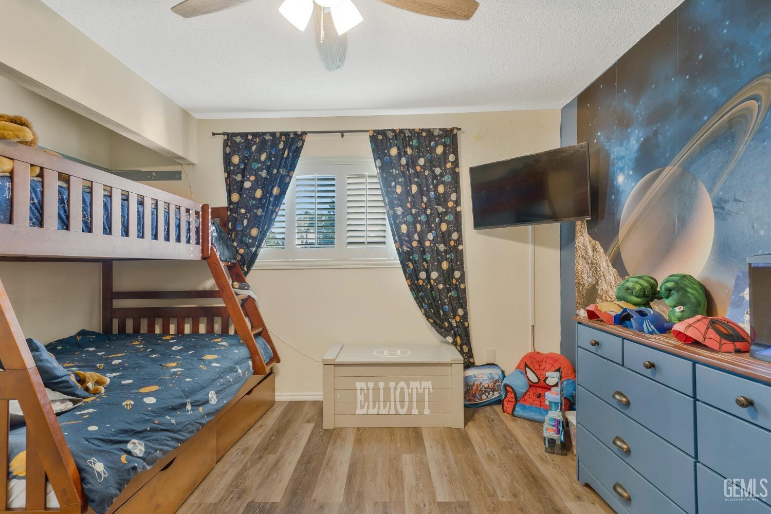 Undisclosed Address Bakersfield, CA 93306 - Photo 21 of 38 a living room with furniture and a flat screen tv
