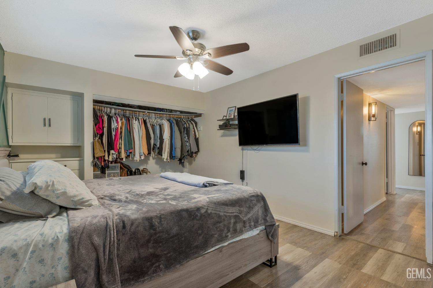 Undisclosed Address Bakersfield, CA 93306 - Photo 24 of 38 a bedroom with a bed and a flat screen tv
