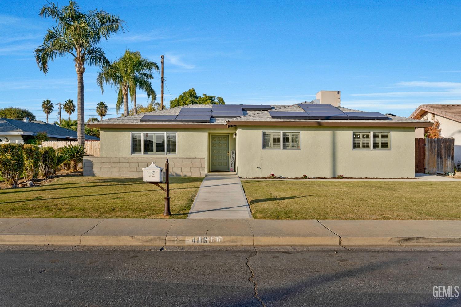 Undisclosed Address Bakersfield, CA 93306 - Photo 35 of 38 a front view of a house with garden