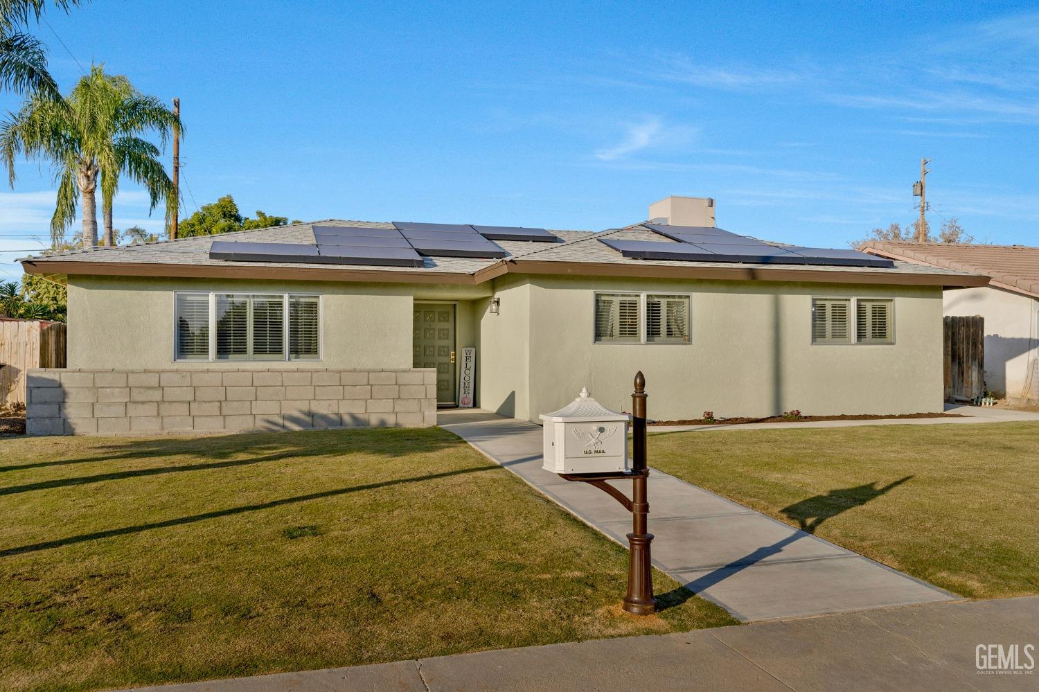 Undisclosed Address Bakersfield, CA 93306 - Photo 38 of 38 a front view of a house with garden