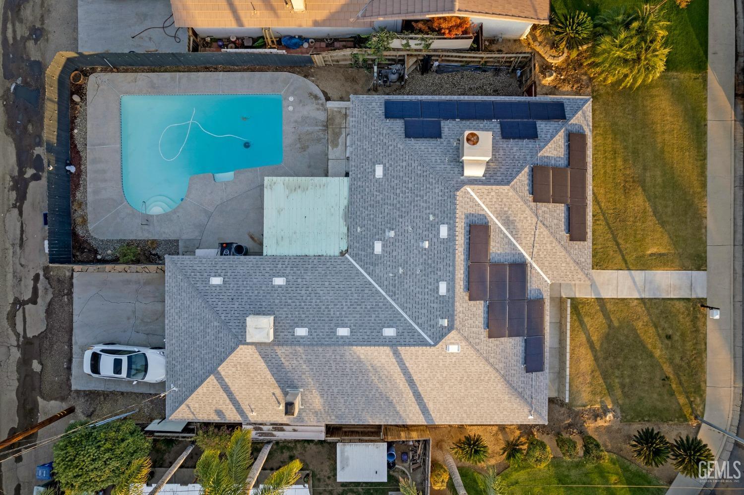 Undisclosed Address Bakersfield, CA 93306 - Photo 4 of 38 an aerial view of a house with swimming pool