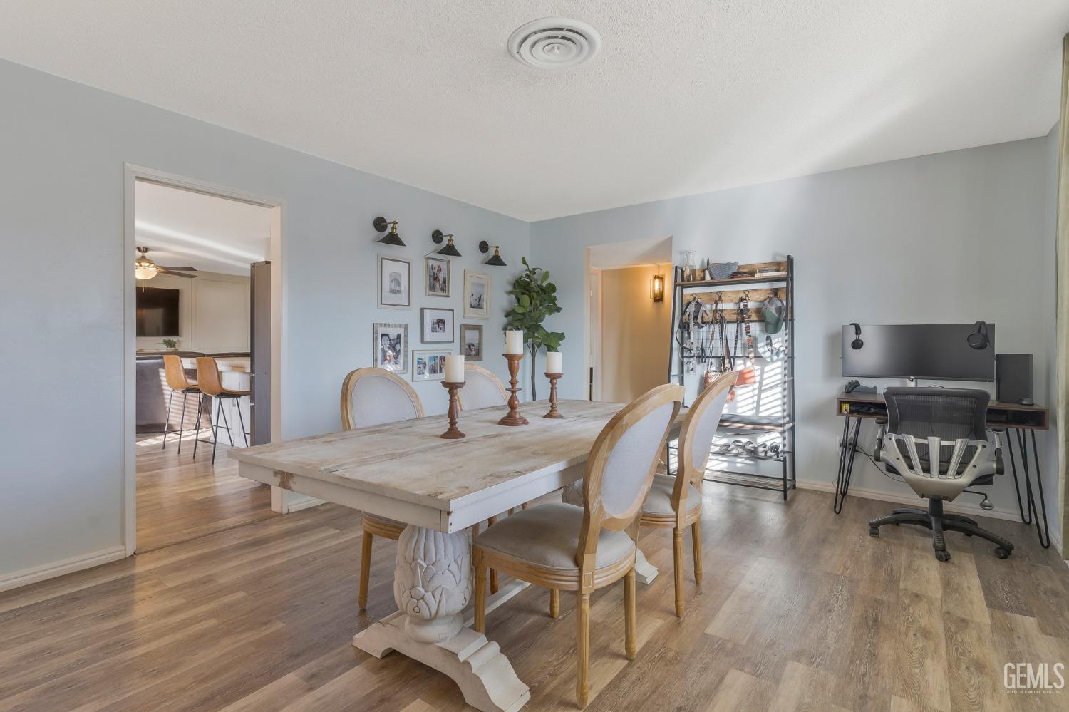 Undisclosed Address Bakersfield, CA 93306 - Photo 8 of 38 a view of a dining room with furniture and wooden floor