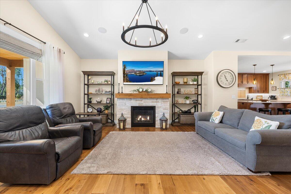 1323 Ellison Loop Merlin, OR 97532 - Photo 6 of 24 Spacious open and bright living area with stone gas fireplace.