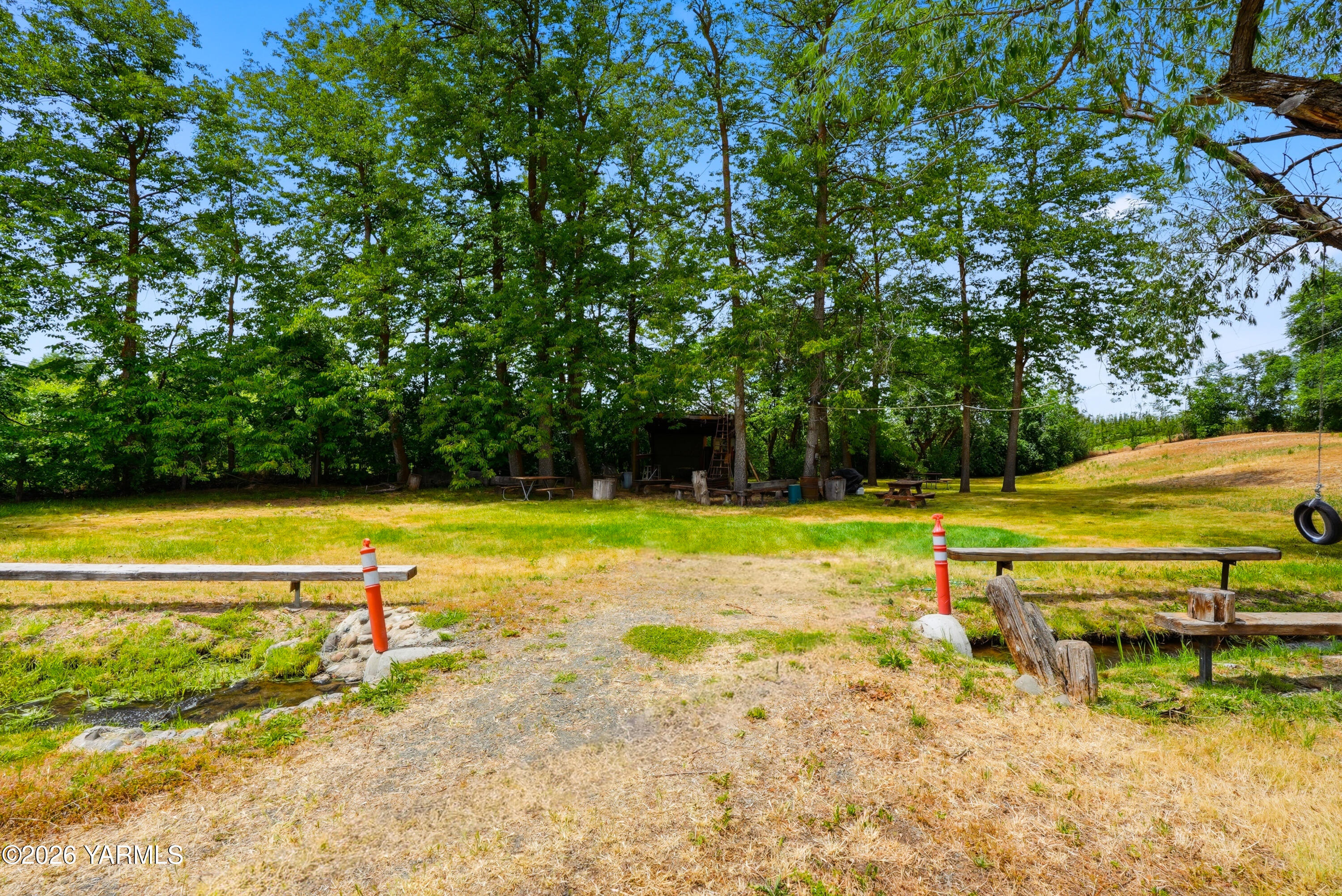 690 North Gleed Road Naches, WA 98937 - Photo 36 of 60 a view of a swimming pool with an outdoor space and seating area
