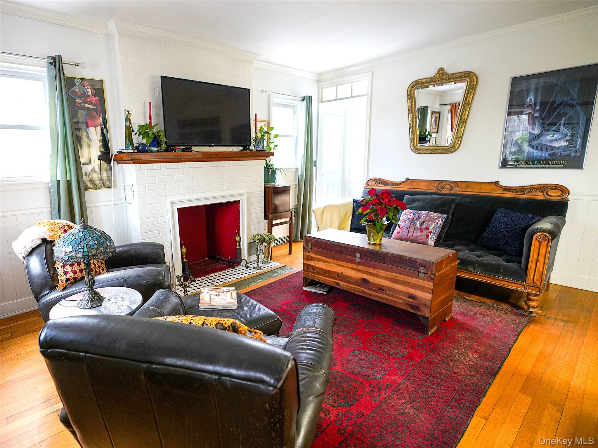 37 Centre Street Bronx, NY 10464 - Photo 2 of 32 a living room with furniture a flat screen tv and a fireplace