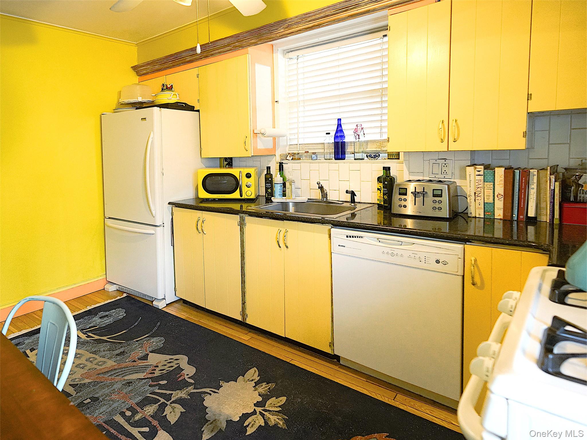 37 Centre Street Bronx, NY 10464 - Photo 23 of 32 a kitchen with stainless steel appliances granite countertop a sink a stove and a refrigerator