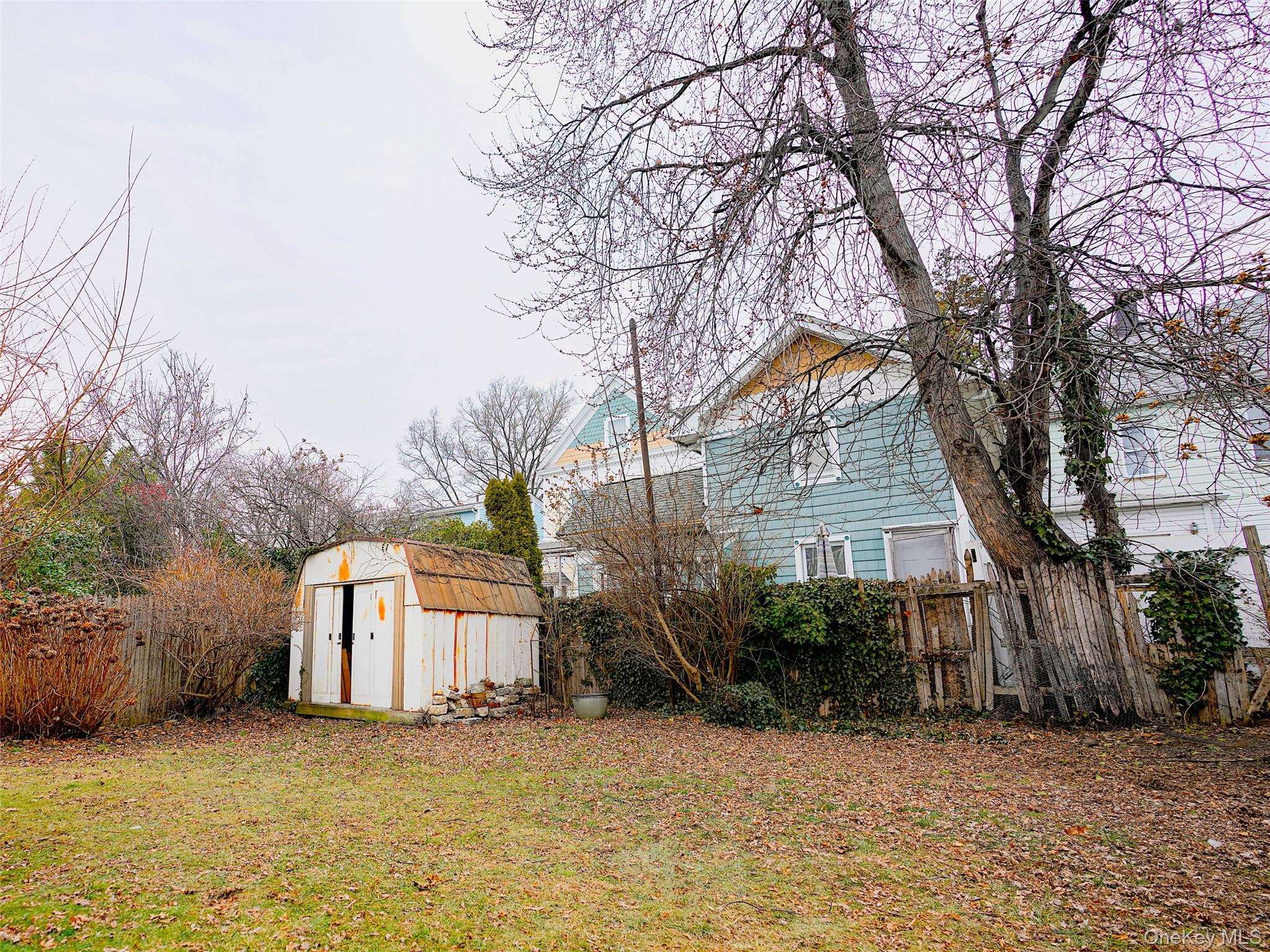37 Centre Street Bronx, NY 10464 - Photo 28 of 32 a white house that has a tree in front of it