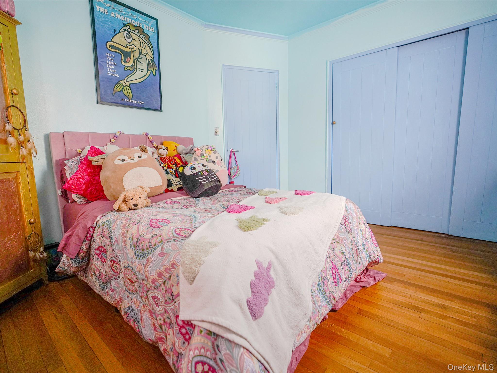 37 Centre Street Bronx, NY 10464 - Photo 9 of 32 a bedroom with a bed and a painting on the wall