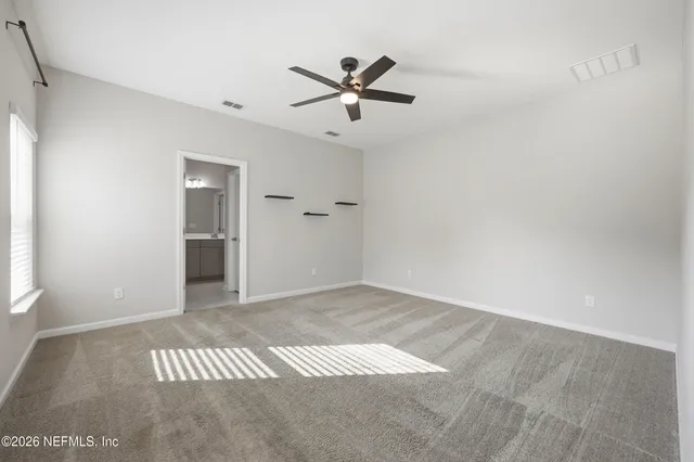 a white bath tub sitting next to a white toilet