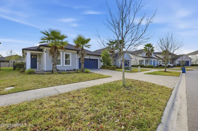 a view of a backyard of the house