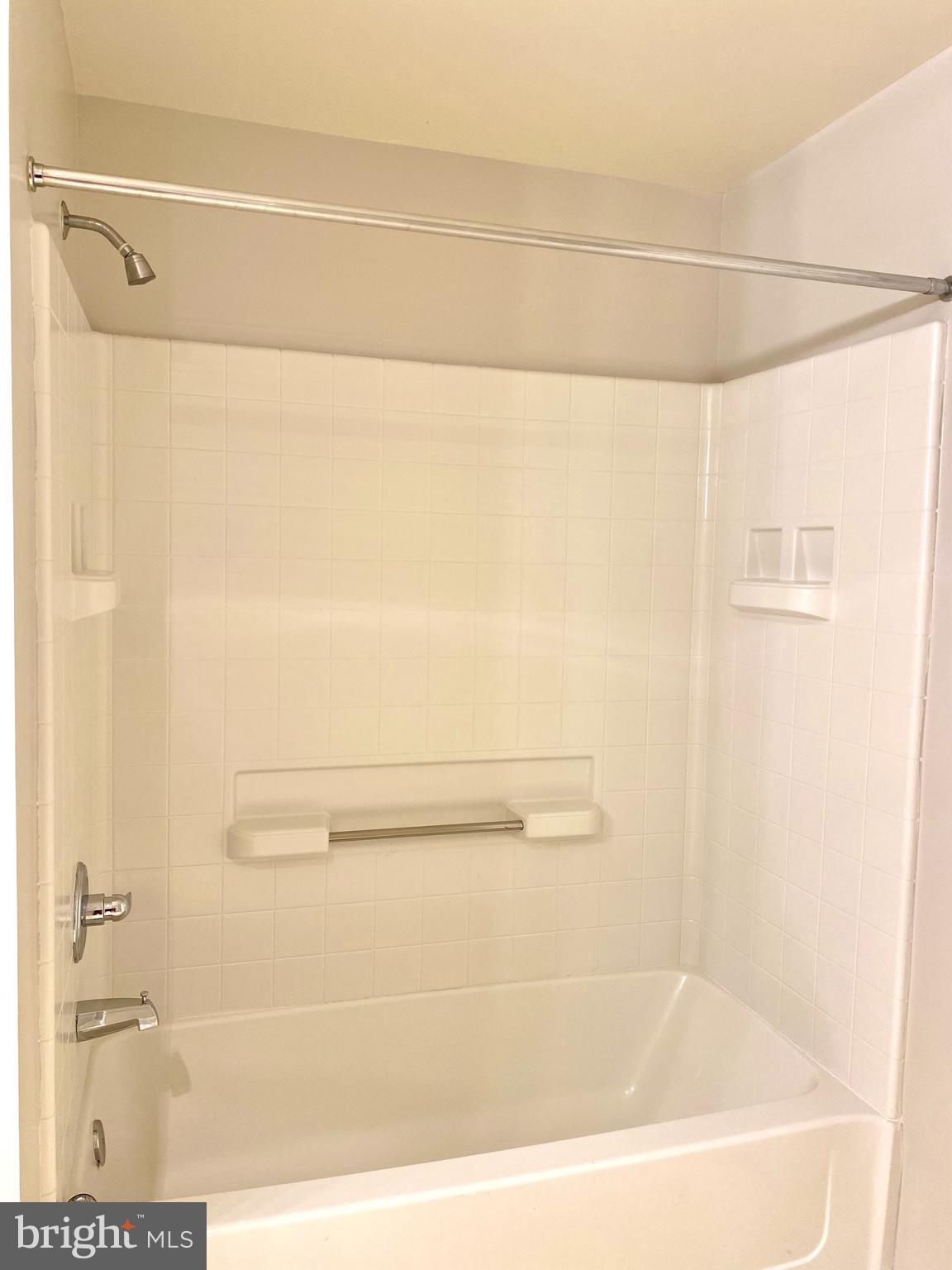 3005 South Leisure World Boulevard, Unit 209 Silver Spring, MD 20906 - Photo 20 of 28 Tub and shower in the primary bathroom