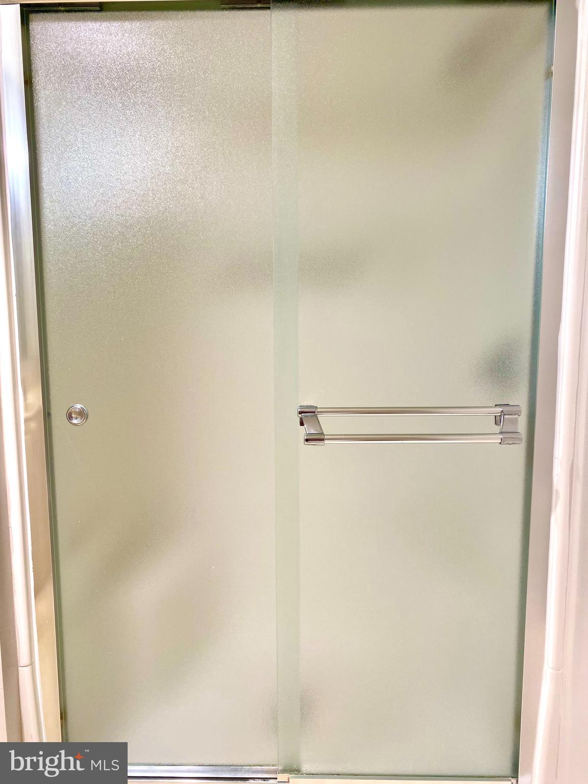 3005 South Leisure World Boulevard, Unit 209 Silver Spring, MD 20906 - Photo 21 of 28 Walk-in shower in the primary bathroom