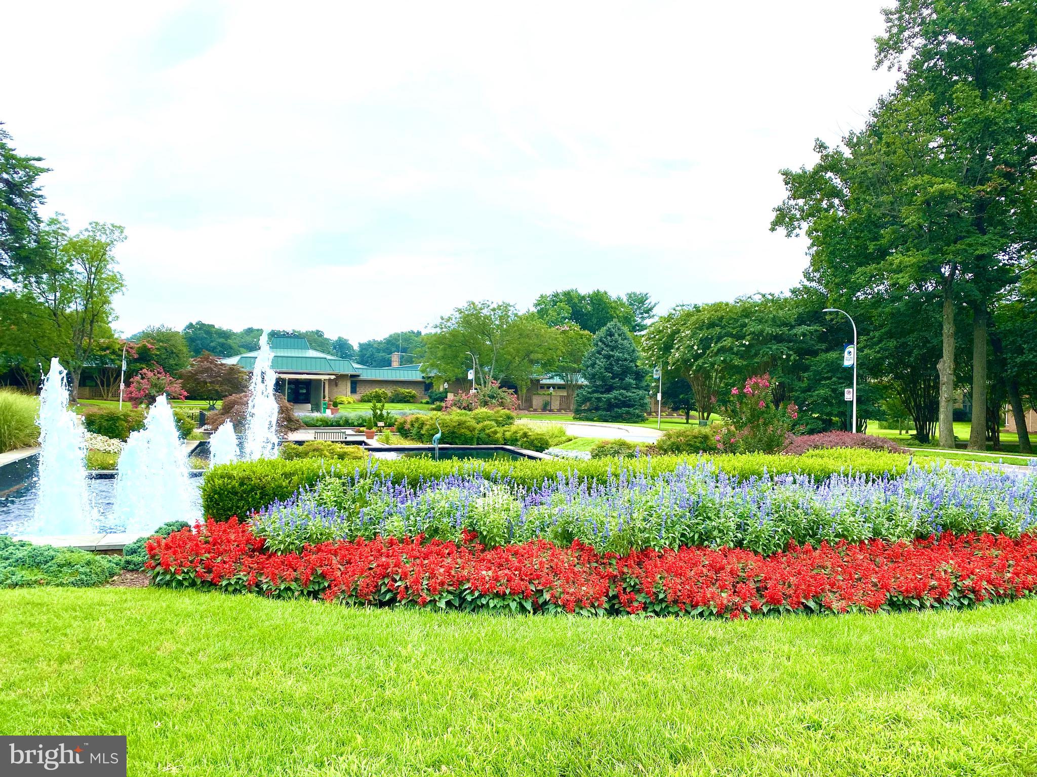 3005 South Leisure World Boulevard, Unit 209 Silver Spring, MD 20906 - Photo 22 of 28 Gardens in front of clubhouse one