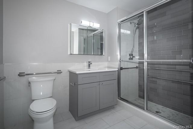 262 Indian Head Road, Unit 211 Kings Park, NY 11754 - Photo 8 of 8 a bathroom with a toilet sink and shower