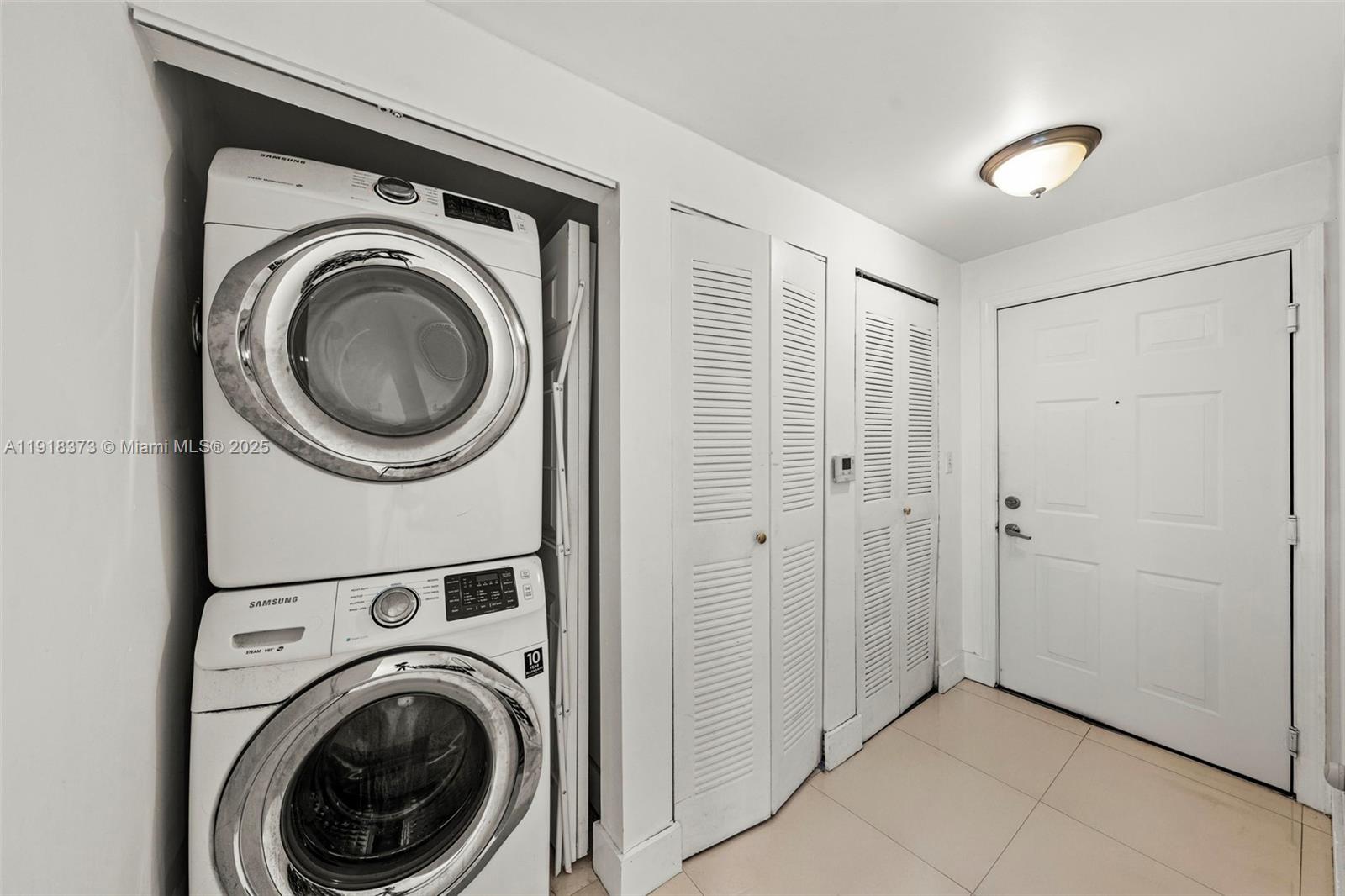 275 Northeast 18th Street, Unit 708 Miami, FL 33132 - Photo 28 of 34 a view of a hallway with washer and dryer