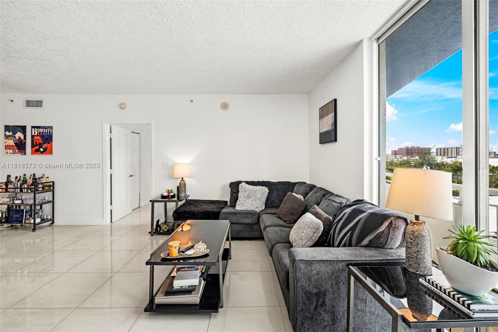 275 Northeast 18th Street, Unit 708 Miami, FL 33132 - Photo 32 of 34 a living room with furniture and wooden floor