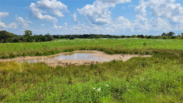 a view of a lake with a big yard