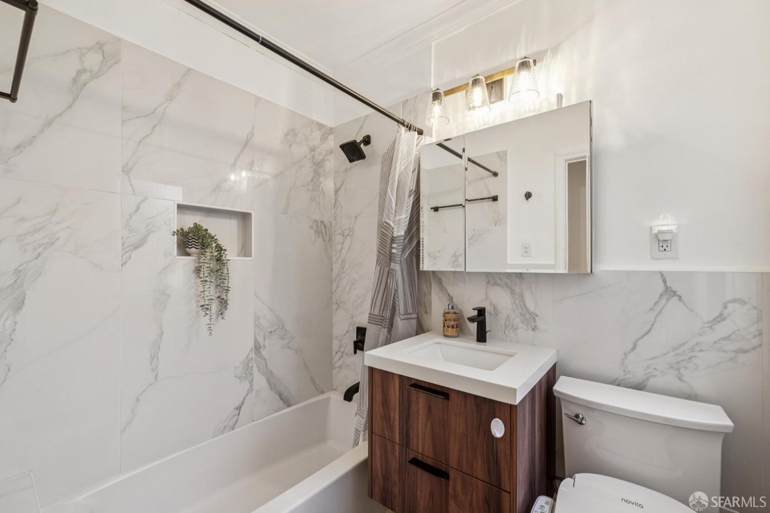 2990 Jackson Street, Unit 4 San Francisco, CA 94115 - Photo 10 of 12 a bathroom with a sink a toilet and shower