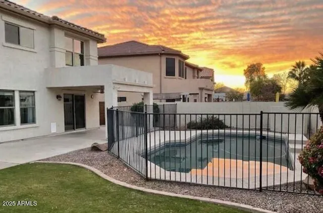 a view of a house with backyard and porch
