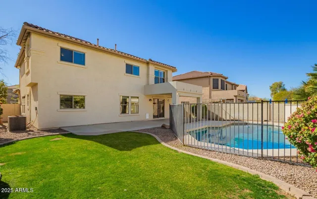 a view of a front of a house with a yard