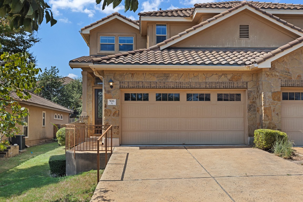 506 Hummingbird Lane, Unit A Austin, TX 78734 - Photo 1 of 36 a front view of a house with a garage