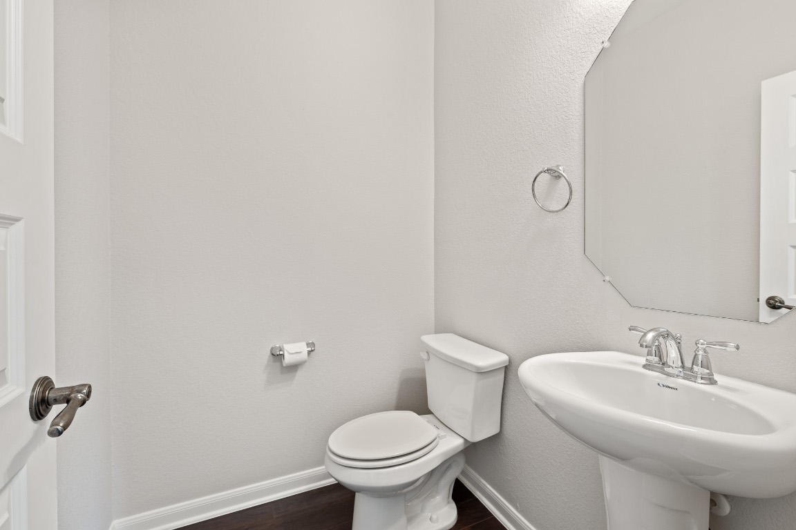 506 Hummingbird Lane, Unit A Austin, TX 78734 - Photo 12 of 36 a bathroom with a sink toilet and a mirror