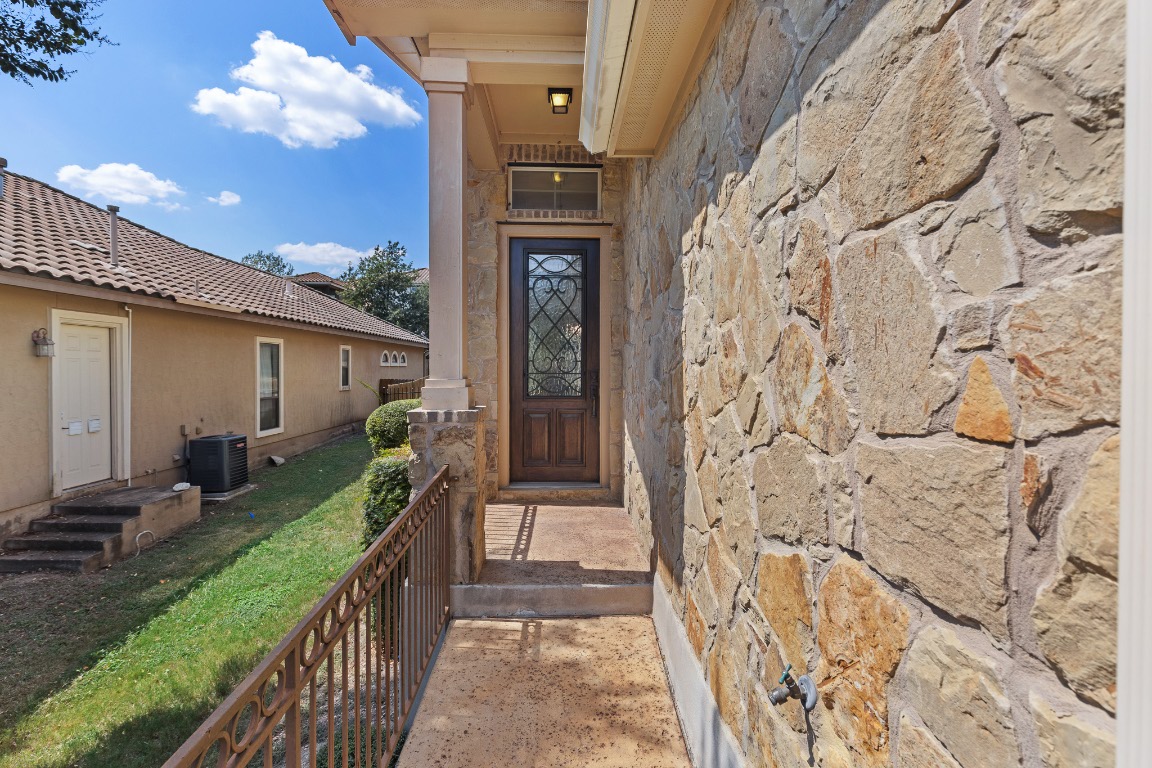 506 Hummingbird Lane, Unit A Austin, TX 78734 - Photo 2 of 36 Doorway to property with stone siding