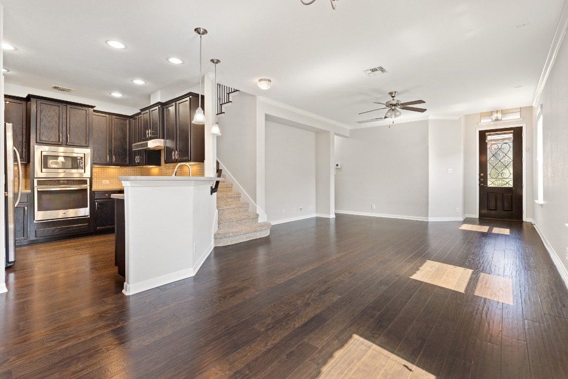 506 Hummingbird Lane, Unit A Austin, TX 78734 - Photo 36 of 36 a view of kitchen with cabinets stainless steel appliances and wooden floor