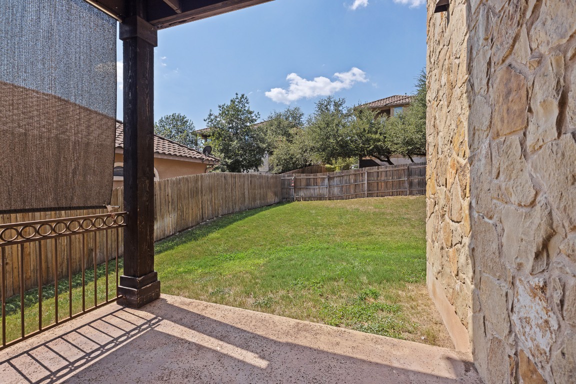 506 Hummingbird Lane, Unit A Austin, TX 78734 - Photo 33 of 36 Fenced backyard with a patio
