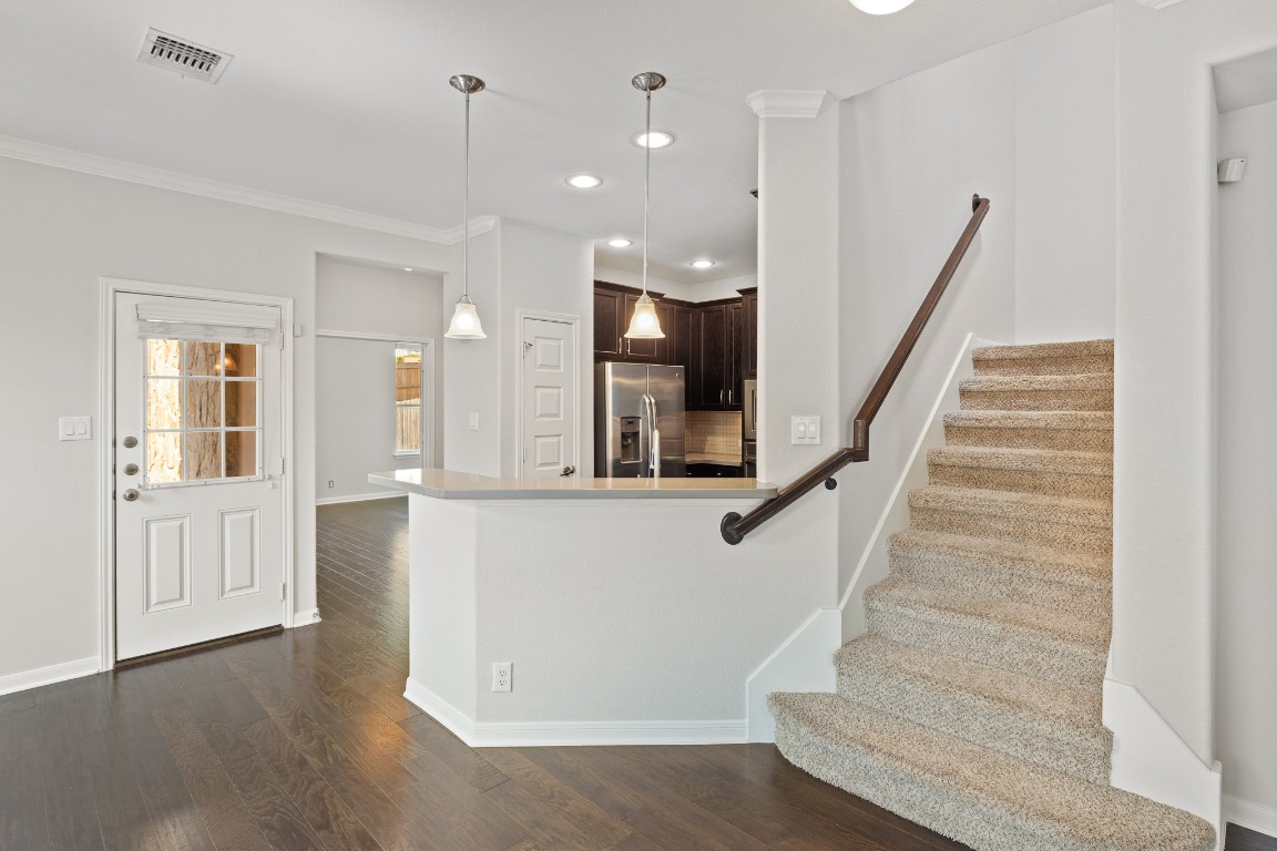 506 Hummingbird Lane, Unit A Austin, TX 78734 - Photo 7 of 36 a view of entryway and hall with wooden floor