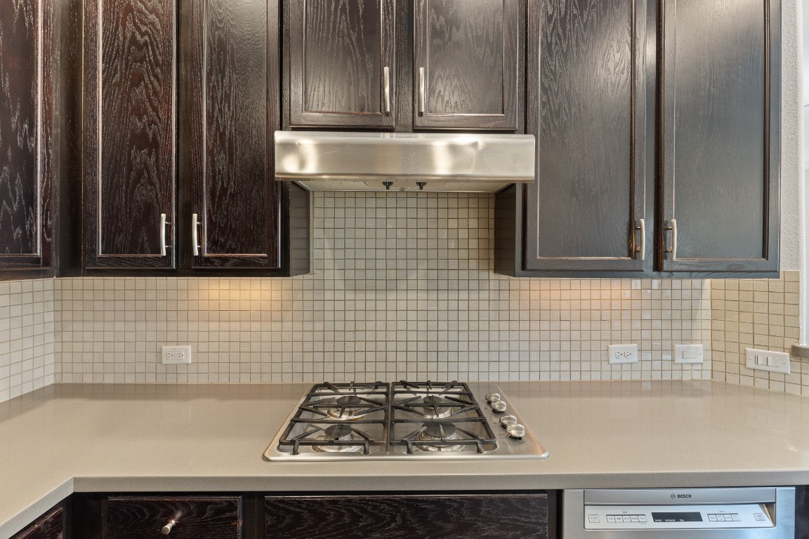 506 Hummingbird Lane, Unit A Austin, TX 78734 - Photo 9 of 36 a bathroom with a sink and a stove