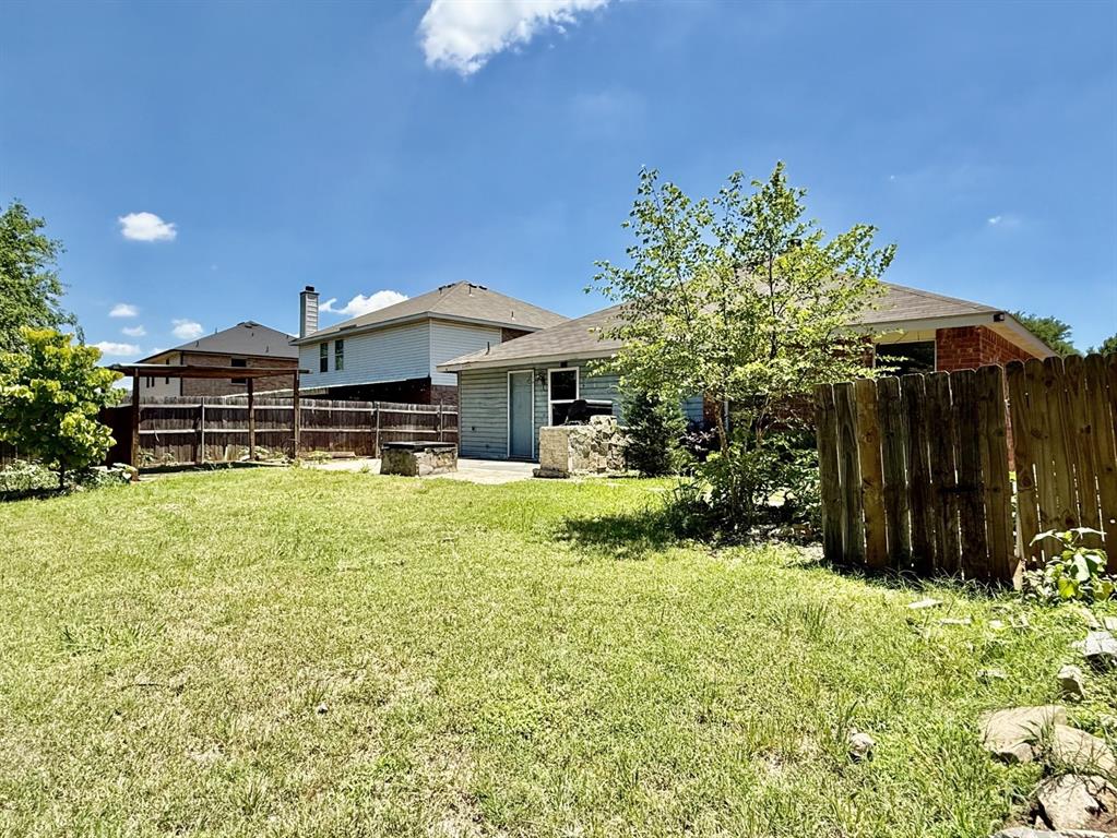 1144 Switchgrass Lane Crowley, TX 76036 - Photo 16 of 17 a front view of a house with a yard