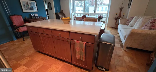 a view of living room with furniture and large window